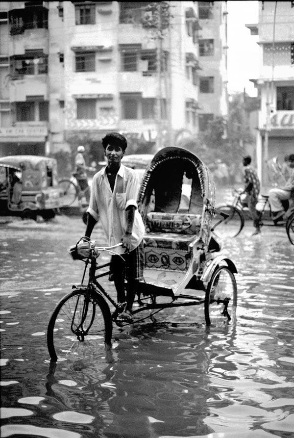 Rickshaw in flooded road