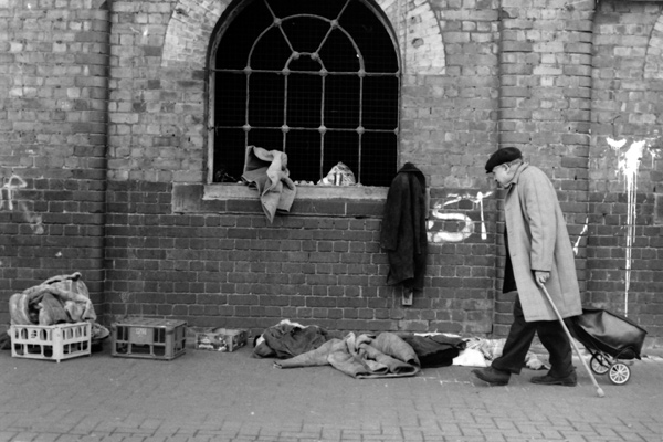 Man searching through clothes at Bishopsgate, 1999