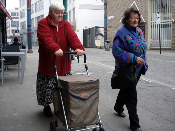 Lady pushing a shopping trolley, Brick Lane 2009