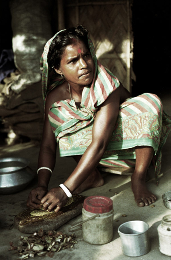 Woman preparing herbs & spices in a village outside Dhaka, 1992