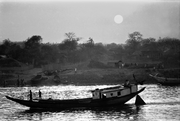 Buriganga river with a boat during sunset, 1992