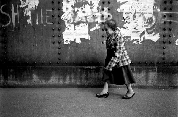 Lady walking on Brick Lane Bridge