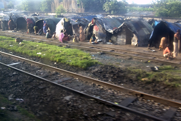Shanty town next to railway tracks. Bangladesh 2008