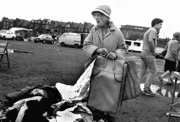 Lady at car boot sale car boot sale, Vallance Rd, London 1984