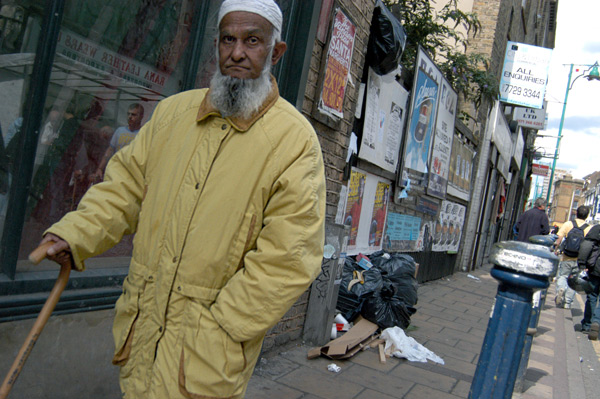 Man with walking stick on Brick Lane. Spitalfields 2002