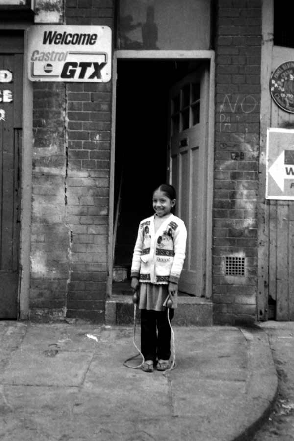 Girl with skipping rope. Stepney 1980's