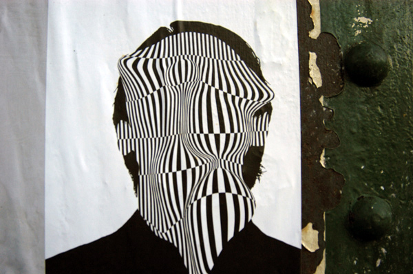 Pattern face on a poster. Brick Lane 2006