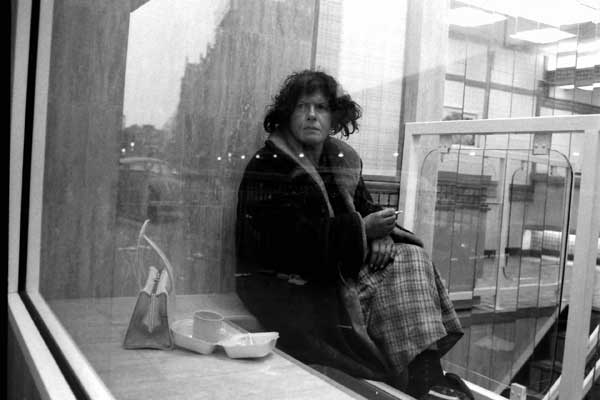 Woman in chicken shop in Bishopsgate, c.1985
