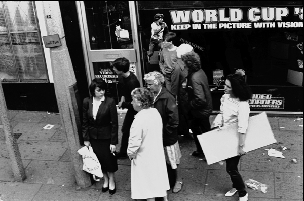 Shoppers at bus stop, Liverpool 1982
