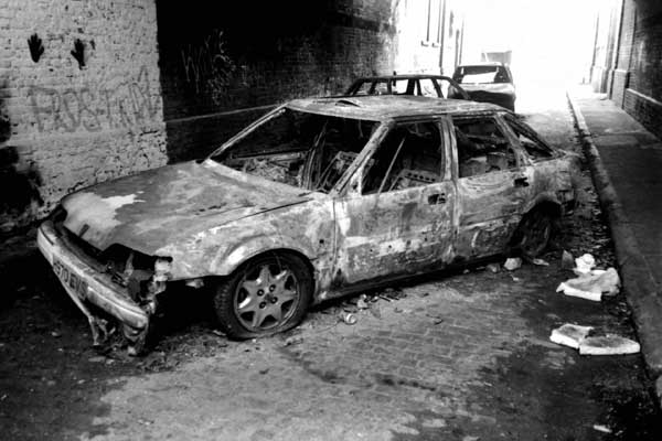 Abandoned & burnt out car, Spitalfields c. 1997