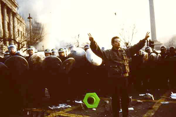 Police face demonstrators in Trafalgar Square at Poll Tax demo 1990