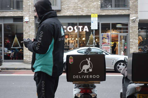 Delivery worker waits for a delivery instruction 2016