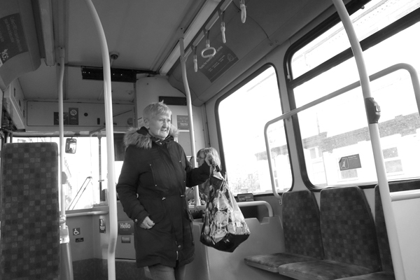Woman with bag. On the bus, Liverpool 2017.