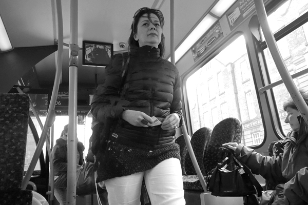 Smiling woman on a bus. Liverpool 2016