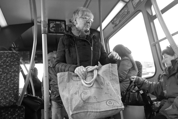Woman with bag on a bus. Liverpool 2016
