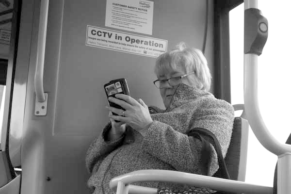 Pensioner on mobile phone. Liverpool 2017