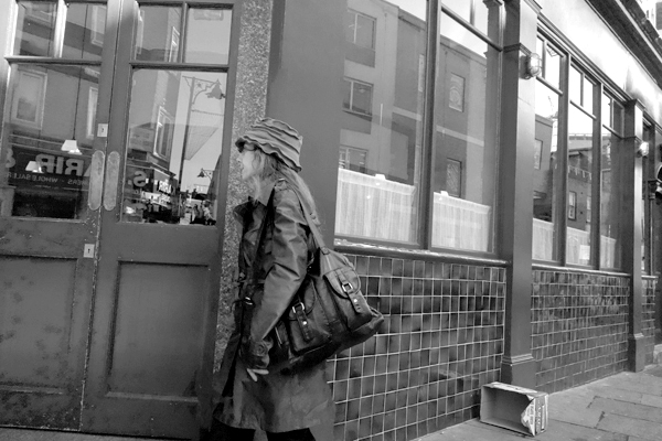 Woman with bag. Osborn Street, East London 2016.