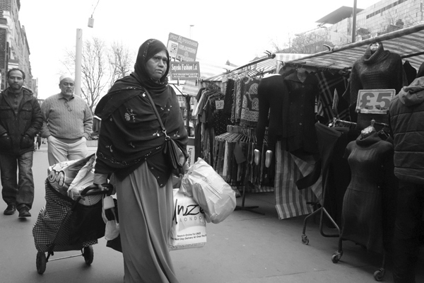 Woman with shopping trolley. Whitechapel Market, London 2016.