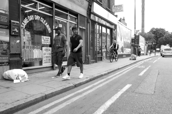 Young men. Vallance Road, London 2013.