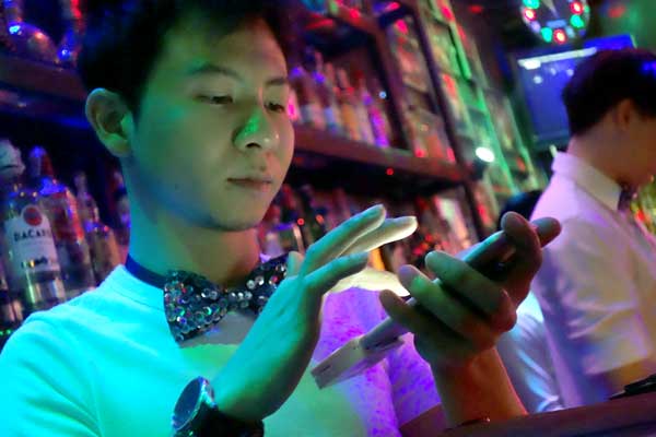 A barman. The Ram Cabaret bar, Chaing Mai Thailand 2017.