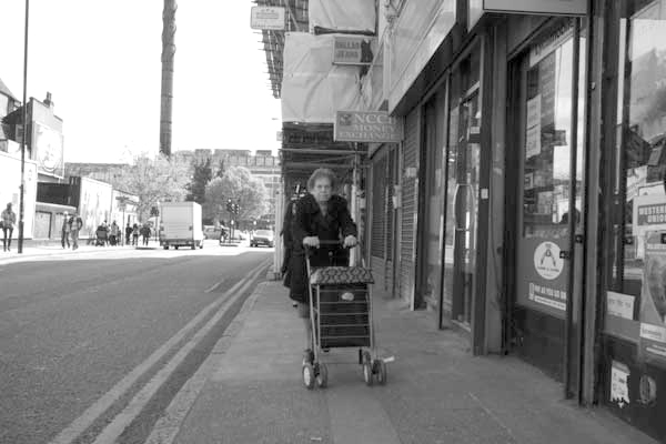 Woman on Vallance Road, London 2014.
