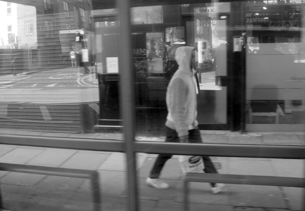 Man in a hood. Bethnal Green Road 2010.