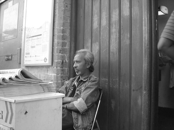 Paper seller. Whitechapel station 2004.