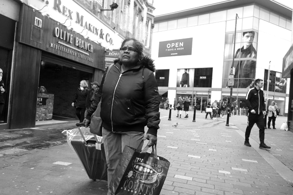 Woman with a trolley bag. Liverpool September 2017.