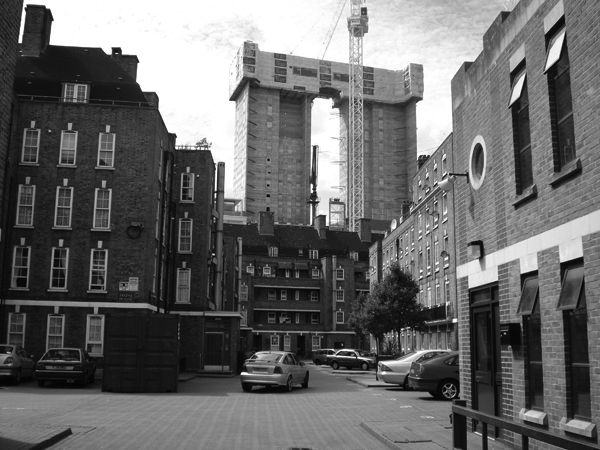 A new City development towers over the Holland Estate. East London, August 2008.