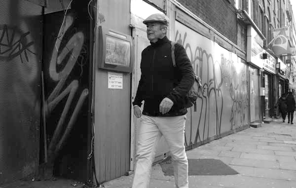 Man wearing a cap in Osborne Street. Spitalfields December 2017.