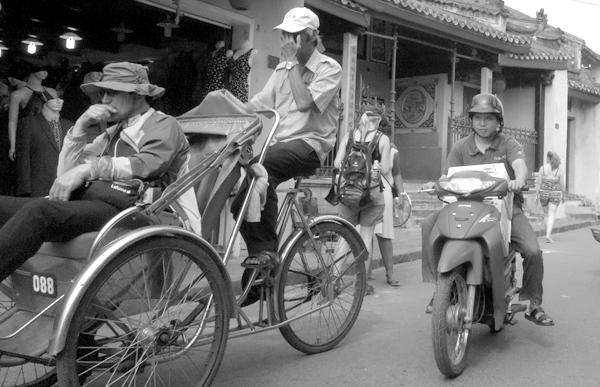 Rickshaw driver & motorcyclist. Hoi An, Vietnam 2016.