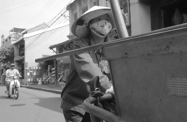 Street cleaner. Hoi An, Vietnam 2016.