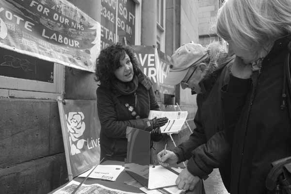 Petition signing against NHS cuts on Bold Street. Liverpool, February 2018. 