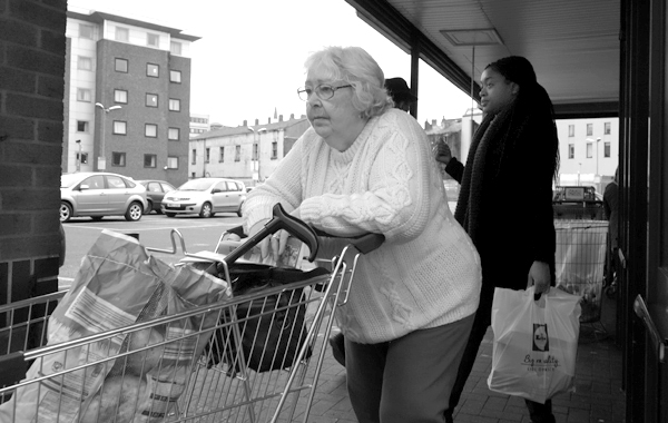 Leaving a supermarket. Liverpool, March 5th 2018.