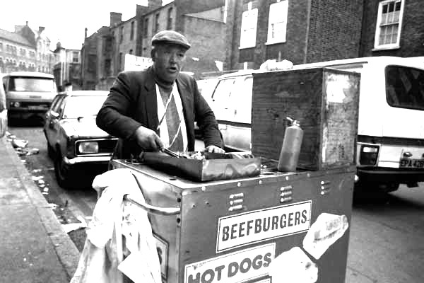 Man selling beefburgers near the Holland Estate, London 2009.