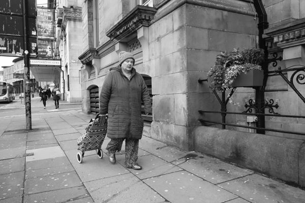 Woman with trolley bag. Lime Street, Liverpool 2017. 