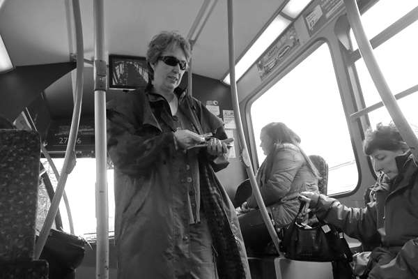 Woman with sun glasses on a bus. Liverpool 2016