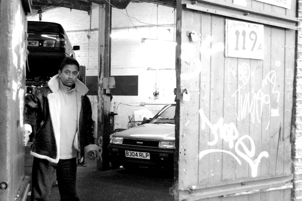 Car repair workshop on Brick Lane. East London 2002.